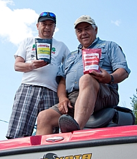 Al Sebastian and Tony Puccio on Tony's boat with a couple bags of Canadian Classic Fishfry.